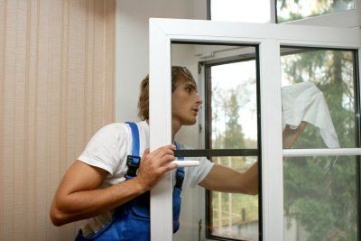 man cleaning window