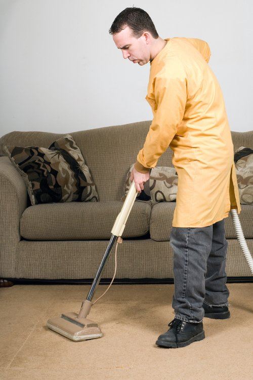 man cleaning a floor 