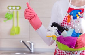 woman with cleaning supplies