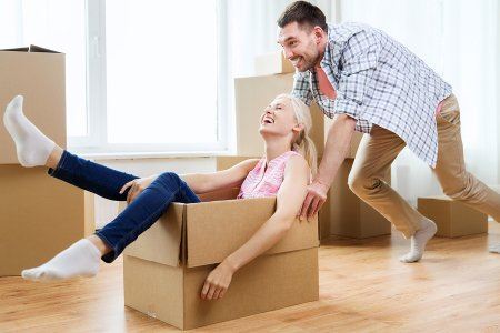 man pushing woman in a box