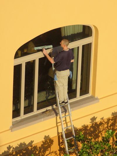 person cleaning windows